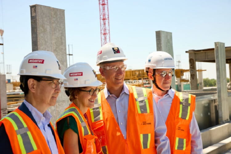 Neuroscience leaders tour research building construction site